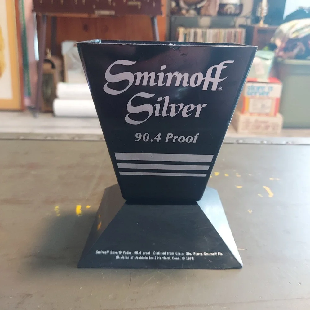 Vintage 1978 Smirnoff Silver 90.4 Proof Vodka Plastic Bottle Display Stand Black
